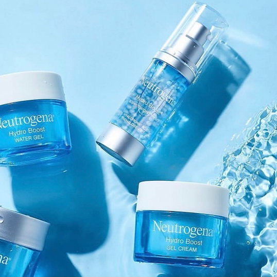 A product spread for Neutrogena featuring products on a blue background with leaves.
